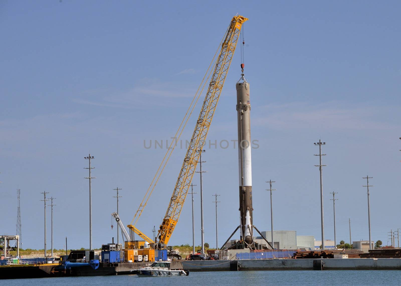 UNITED STATES, Port Canaveral: The first stage of a SpaceX Falcon 9 rocket is seen on the drone ship 'Of course I still love you' docked at Port Canaveral, on April 12, 2016, after its successful landing in the Atlantic Ocean.