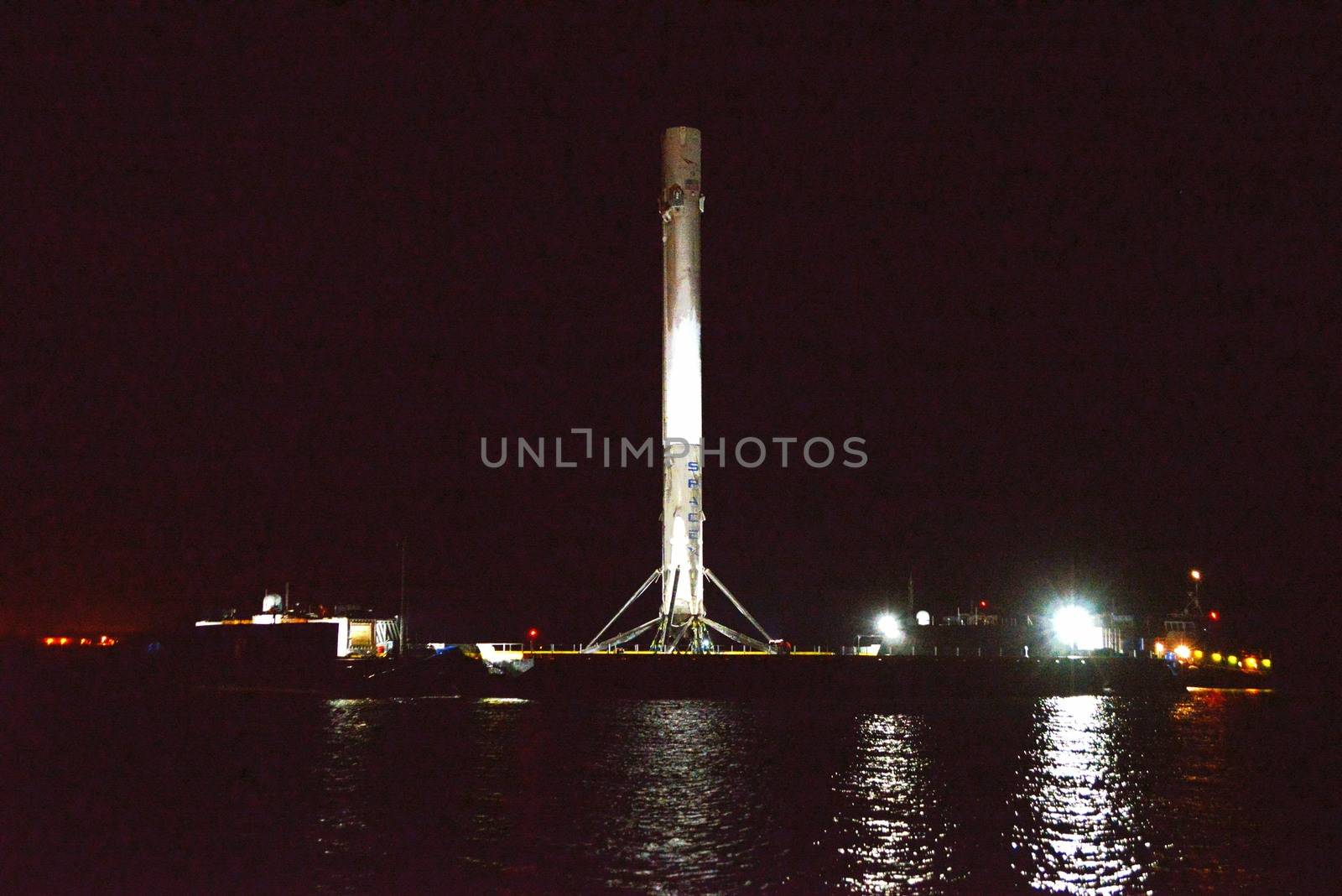 UNITED STATES, Port Canaveral: The first stage of a SpaceX Falcon 9 rocket is seen on the drone ship 'Of course I still love you' docked at Port Canaveral, on April 12, 2016, after its successful landing in the Atlantic Ocean.