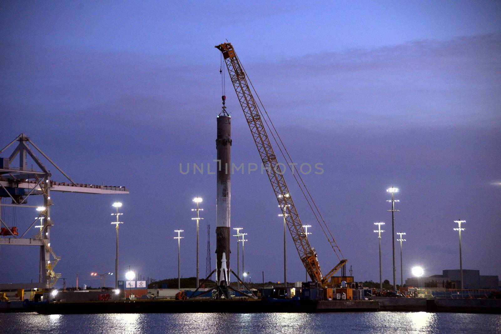 UNITED STATES, Port Canaveral: The first stage of a SpaceX Falcon 9 rocket is seen on the drone ship 'Of course I still love you' docked at Port Canaveral, on April 12, 2016, after its successful landing in the Atlantic Ocean.