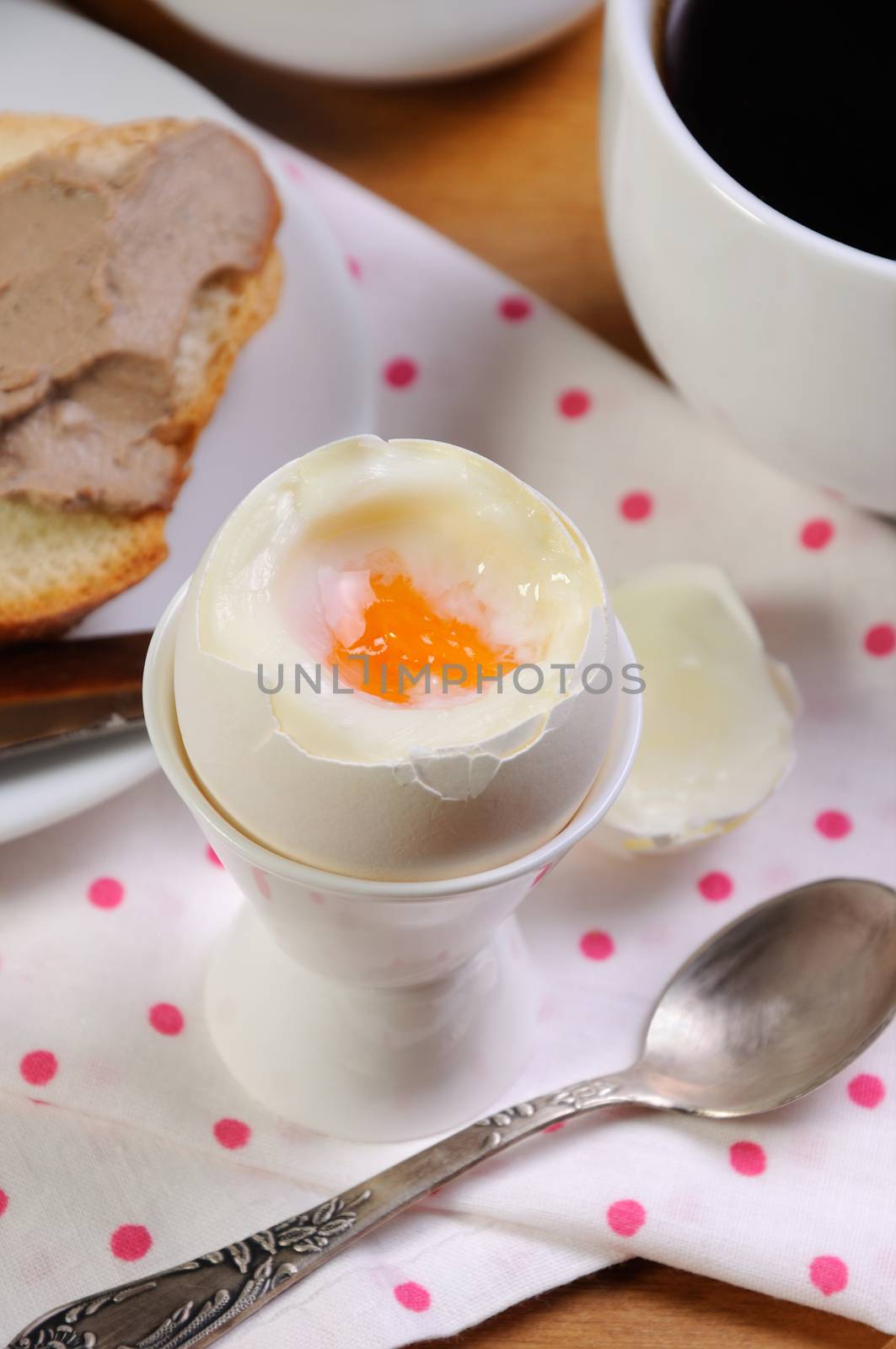 Eggs boiled in pashotnitse for breakfast with a cup of coffee and liver pate