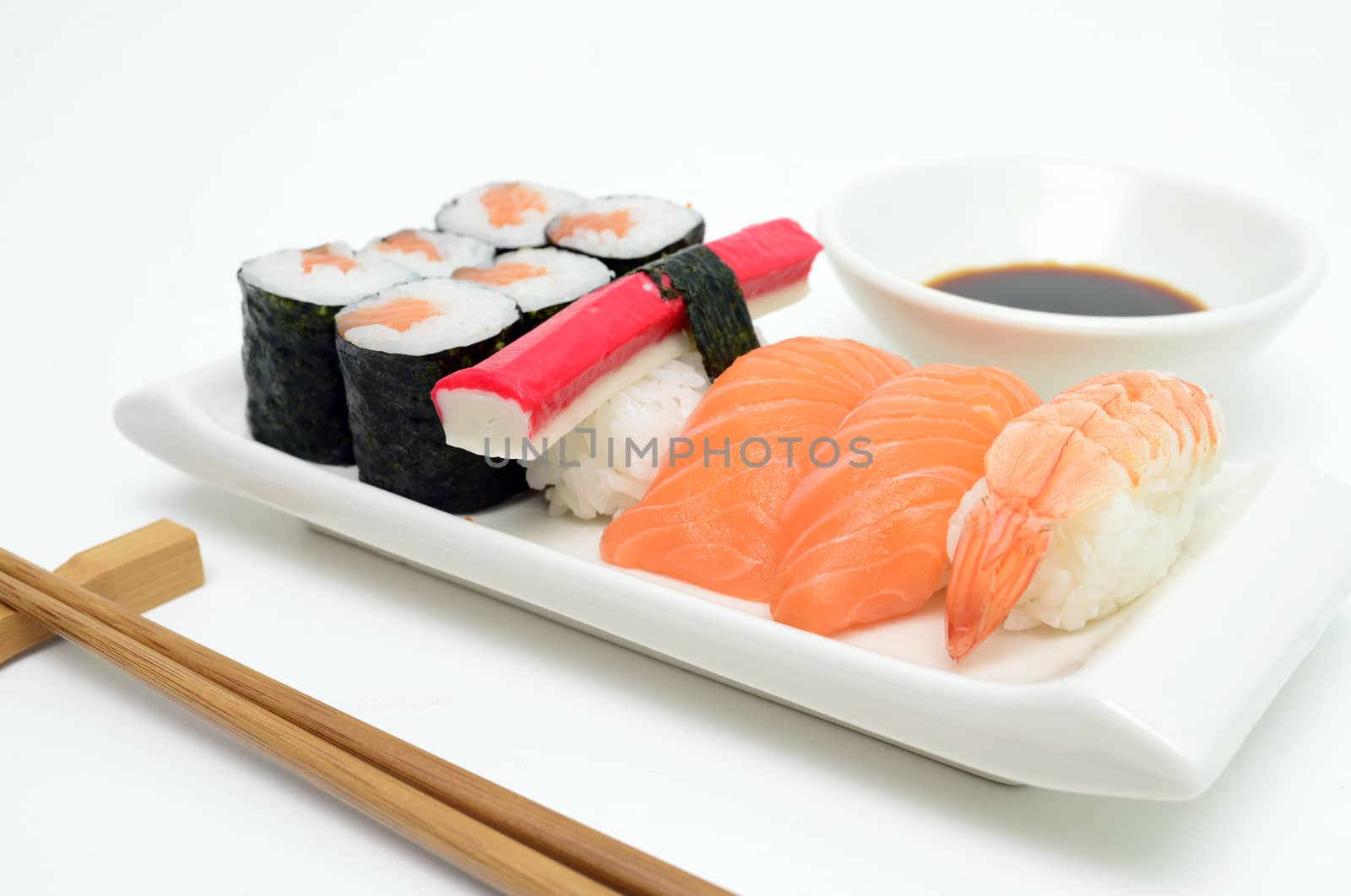 salmon and surimi sushi tray over white background