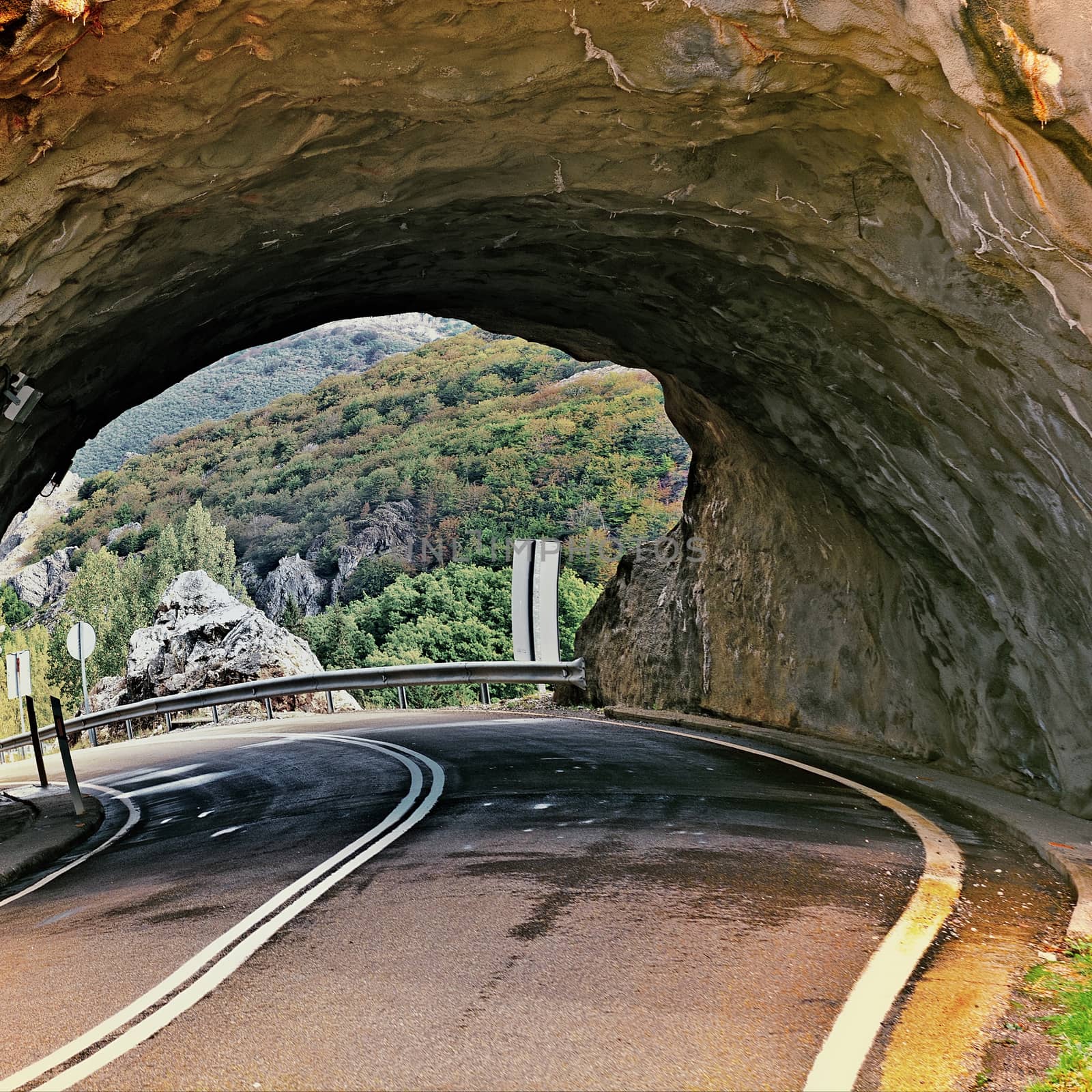 Tunnel on the Winding Asphalt Road in Spain, Vintage Style Toned Picture