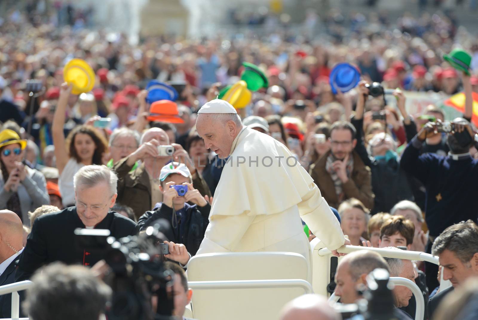 VATICAN, Rome: A crowd looks on as Pope Francis rides in the Pope Mobile at his weekly general audience in St. Peter's Square, at the Vatican on April 13, 2016.The Pope's message was that Jesus is a good doctor, and there is no sickness he cannot cure. He went on to mention how Jesus got sinners, including St. Matthew, to follow him and be disciples. 