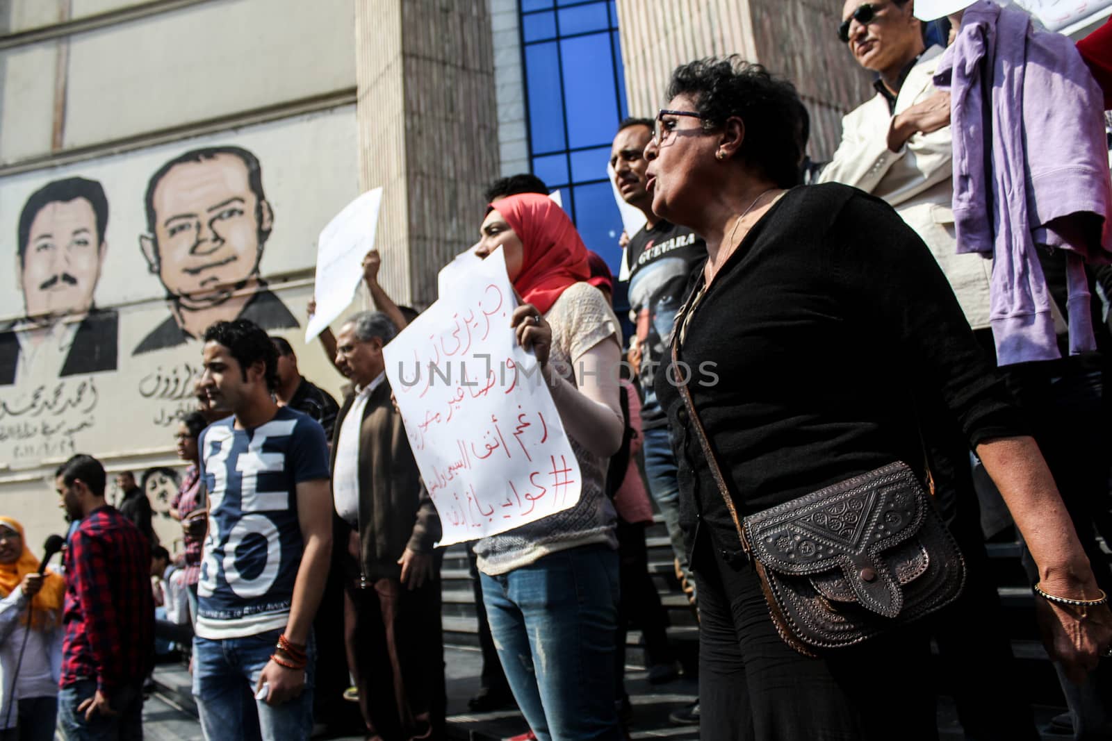 EGYPT, Cairo: Protesters hold banners against Egypt's decision to cede sovereignty over two Red Sea islands, Sanafir and Tiran, to Saudi Arabia on April 13, 2016 in Cairo, before the syndicate of journalists building. Online, many Egyptians have accused their once-popular President, Abdel-Fattah el-Sissi, of giving up land to curry favor with the Saudis. On Twitter, the hashtag I feel like selling what to Saudi Arabia trended on April 12, 2016 with commentators suggesting Egypt flog everything from self-serving lawmakers to President Abdel-Fattah el-Sissi himself.