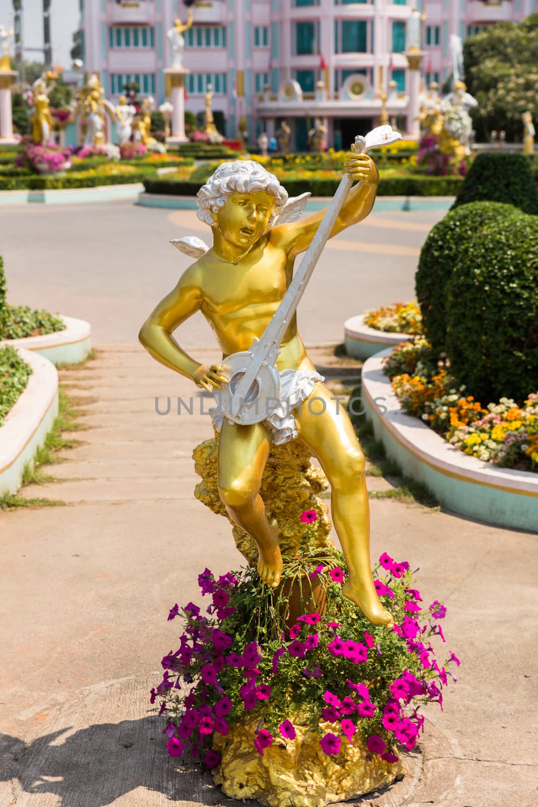 golden statue of Cupid in the park