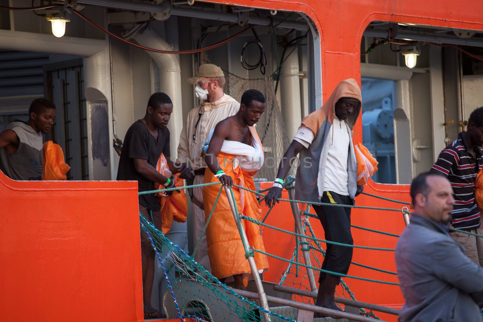 ITALY, Palermo: Migrants disembark from the Siem Pilot on April 13, 2016 in Palermo, Italy.The vessel has been a major transporter of migrants fleeing the Middle East and Africa to Europe. 