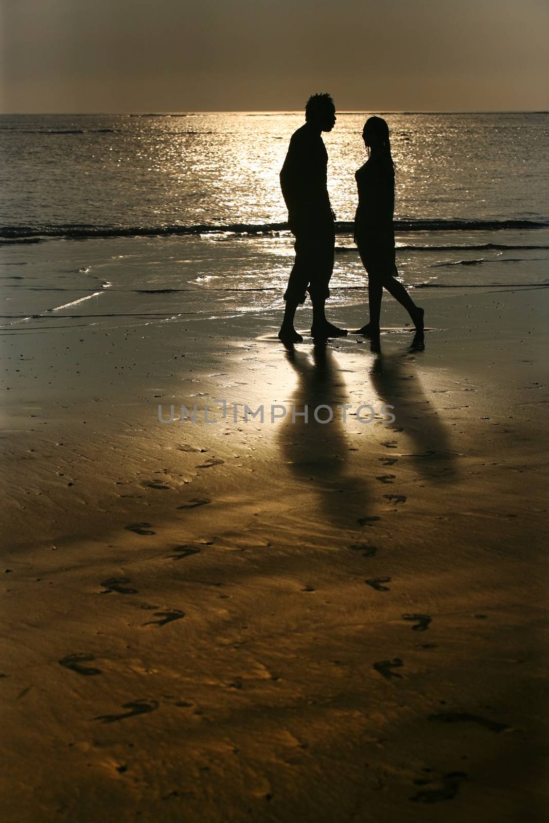 Couple on sunset. Coast of the Indian ocean