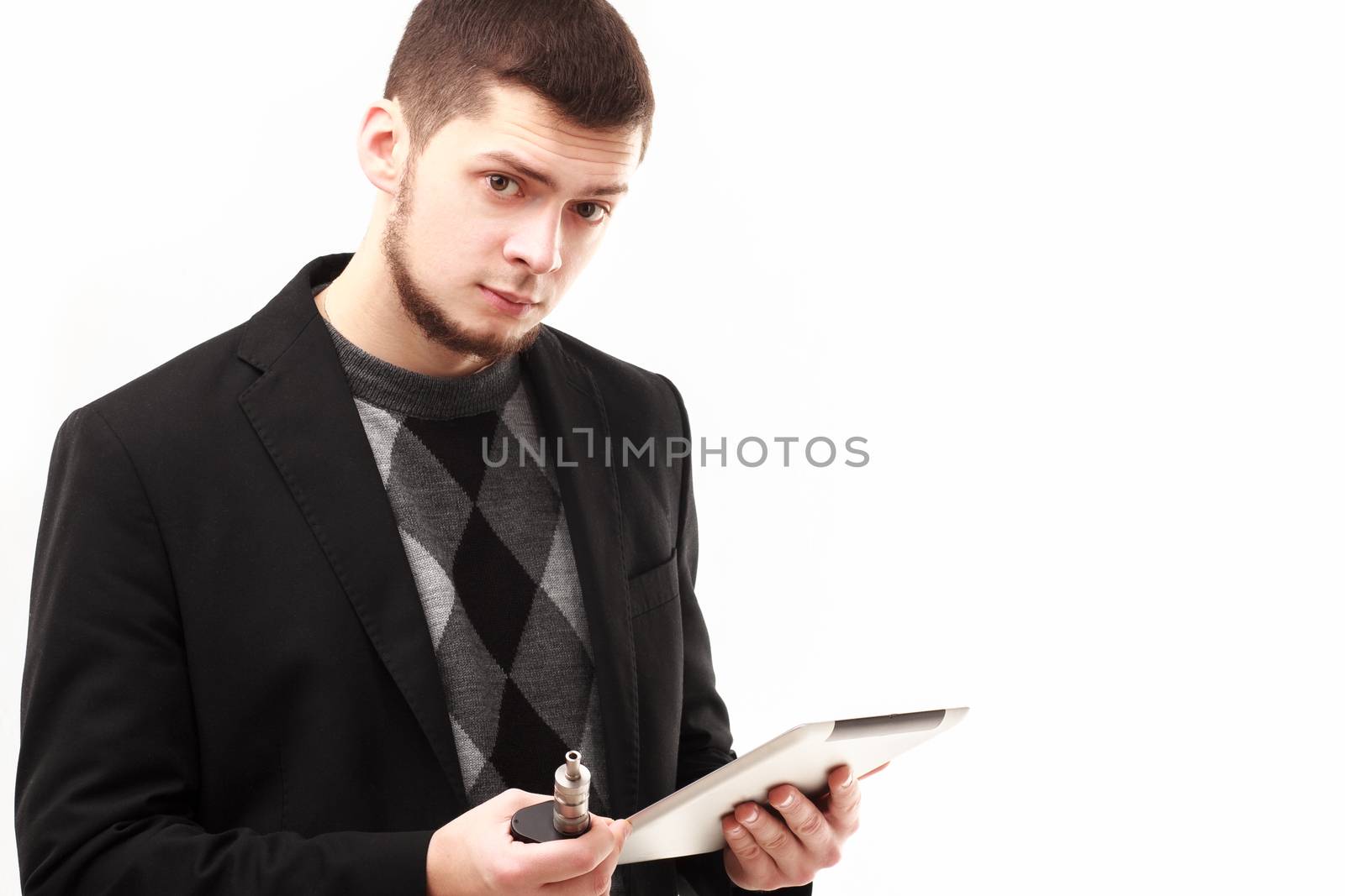 Businessman with tablet and e-cigarette by DmitryOsipov