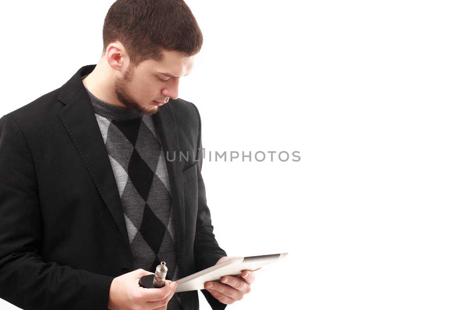 Casual businessman using his tablet and e-cigarette isolated on white