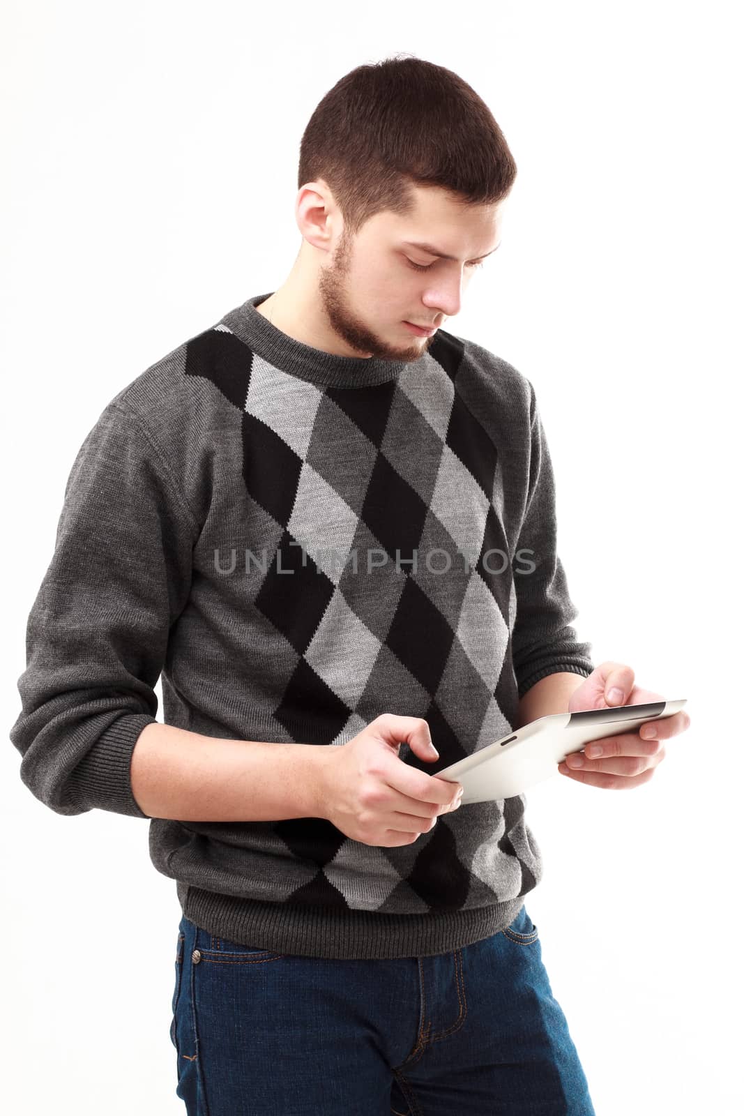 Casual businessman using his tablet isolated on white