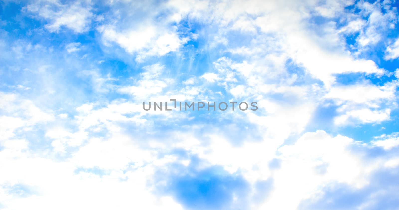 Blue sky with tiny clouds