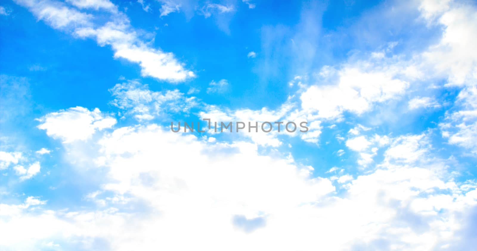 Blue sky with tiny clouds