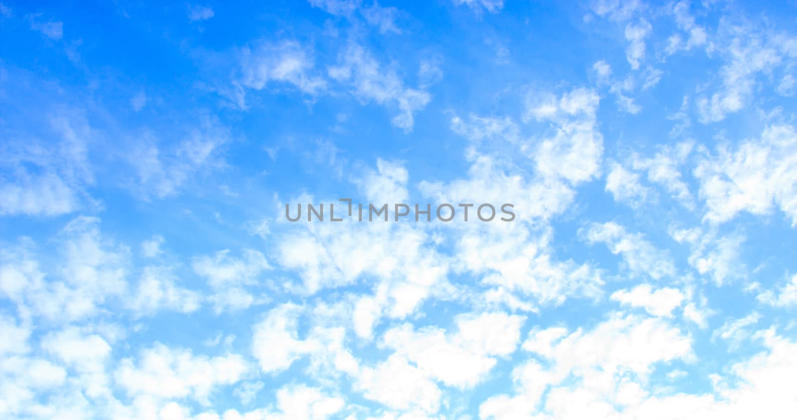 Blue sky with tiny clouds