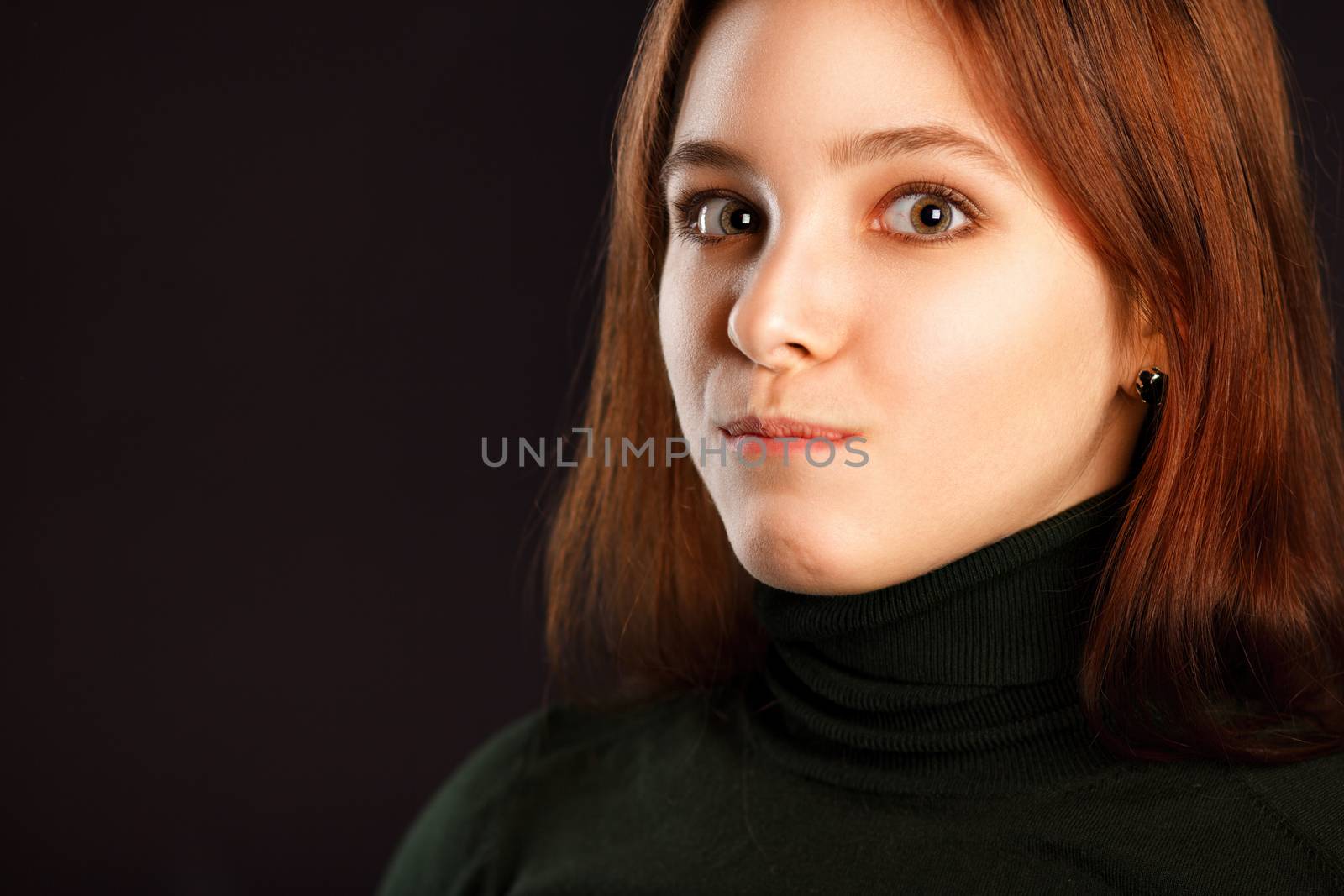Surprised redhead woman on dark by DmitryOsipov