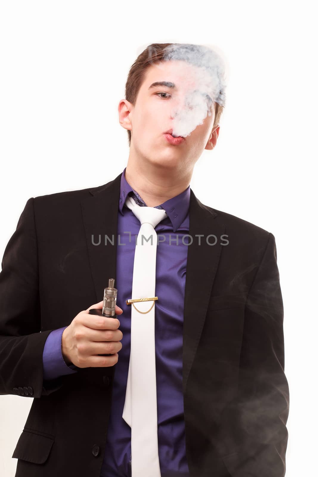 Portrait of a man in suit smoking an e-cigarette isolated on whi by DmitryOsipov