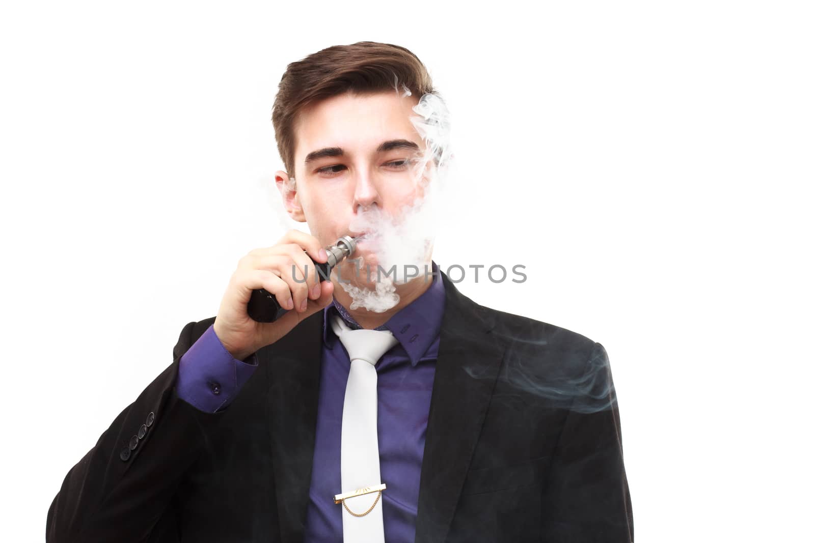 Portrait of a man in suit smoking an e-cigarette isolated on whi by DmitryOsipov