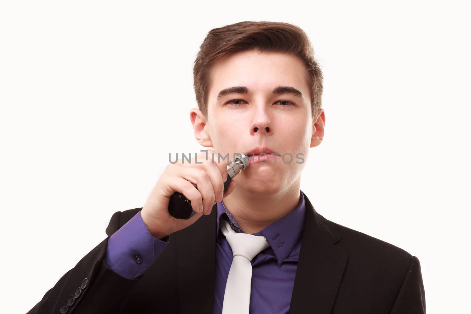 Portrait of a man in suit smoking an e-cigarette isolated on white