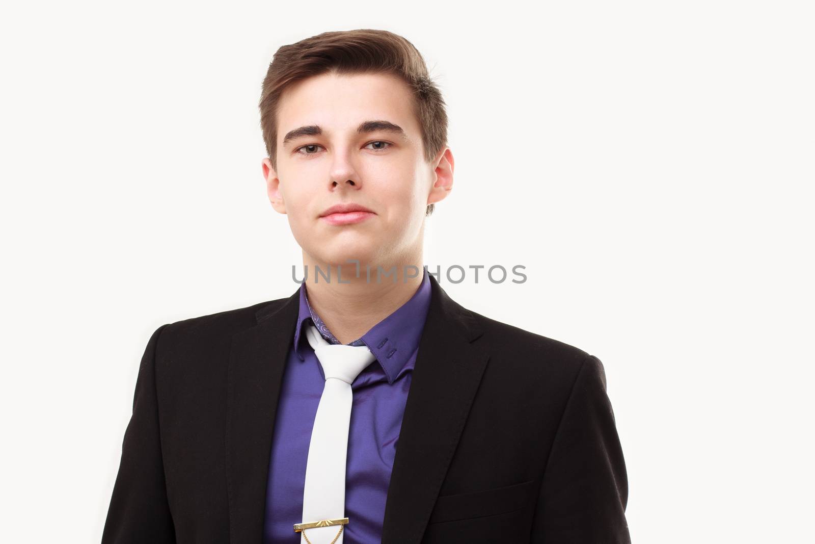 Close-up portrait of young business man wearing suit and tie by DmitryOsipov