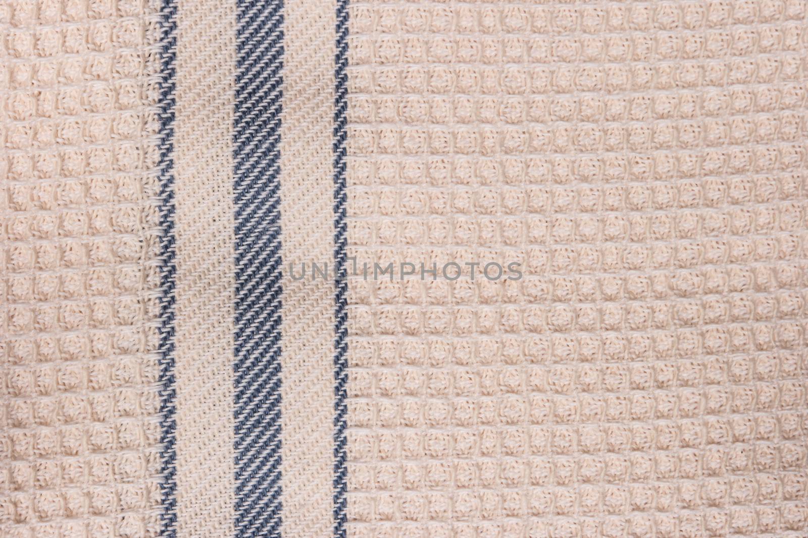 Blue and white striped towel fabric. Tablecloth texture. Cotton texture closeup, background