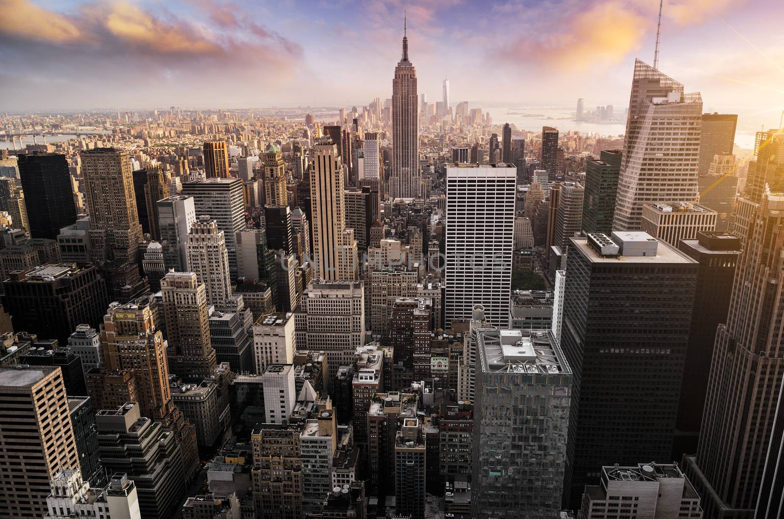 New York City skyline with urban skyscrapers at sunset, USA.