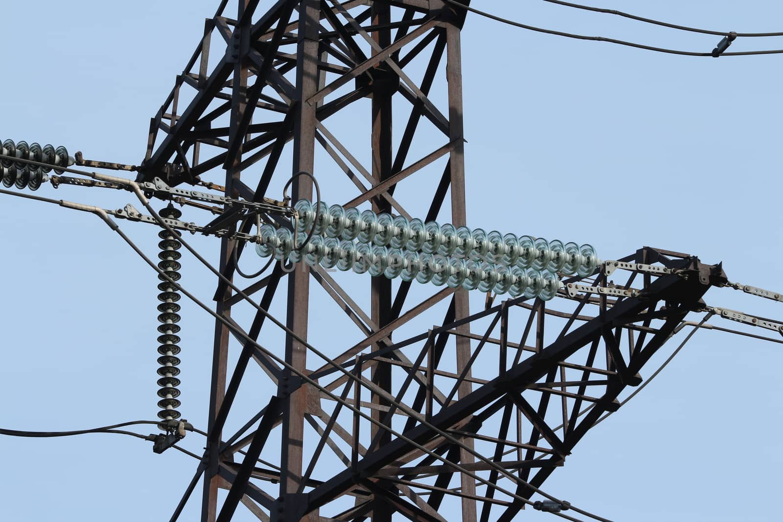 High-voltage electrical insulator electric line against the blue sky
