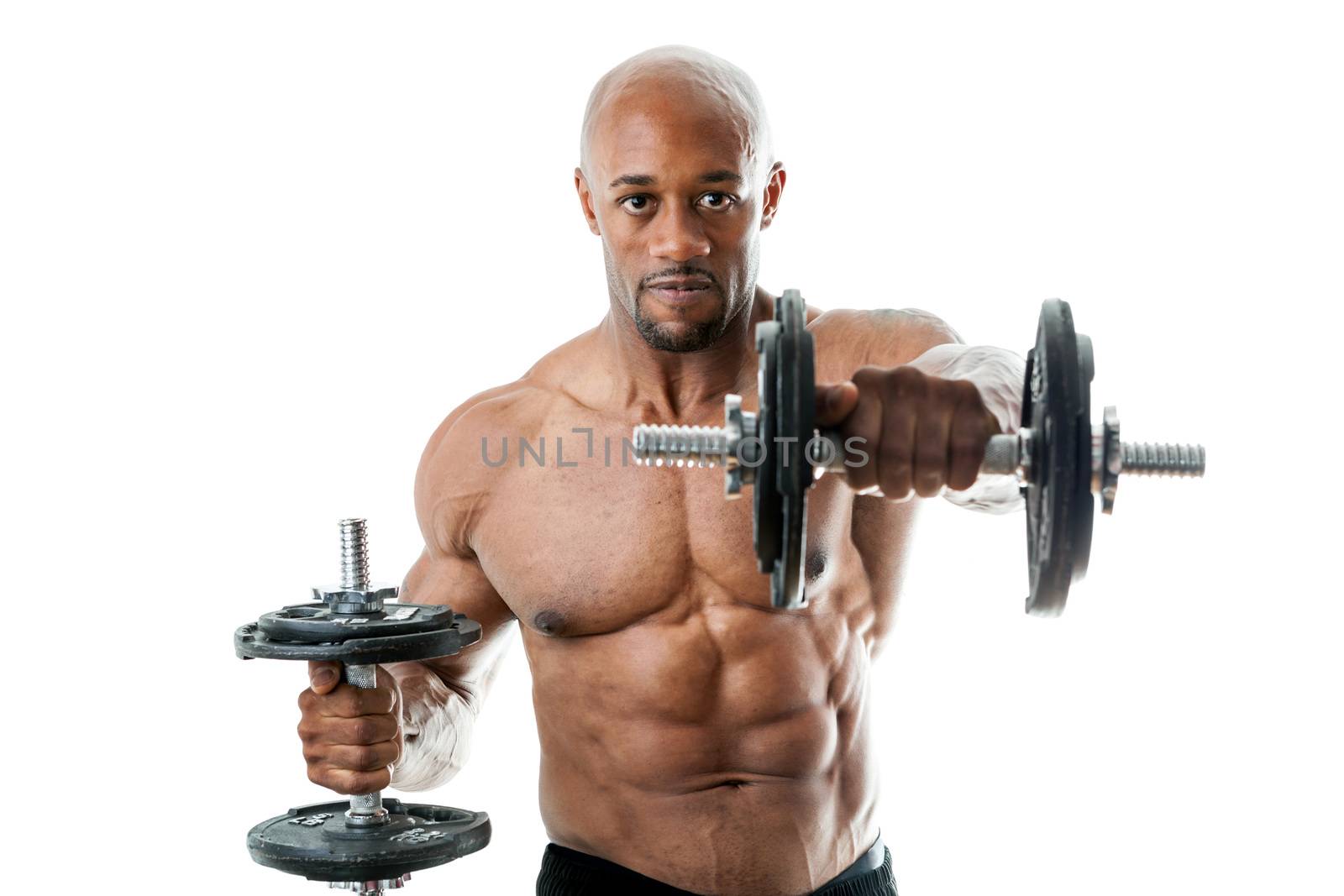 Toned and ripped lean muscle fitness man lifting weights isolated over a white background. Shallow depth of field.