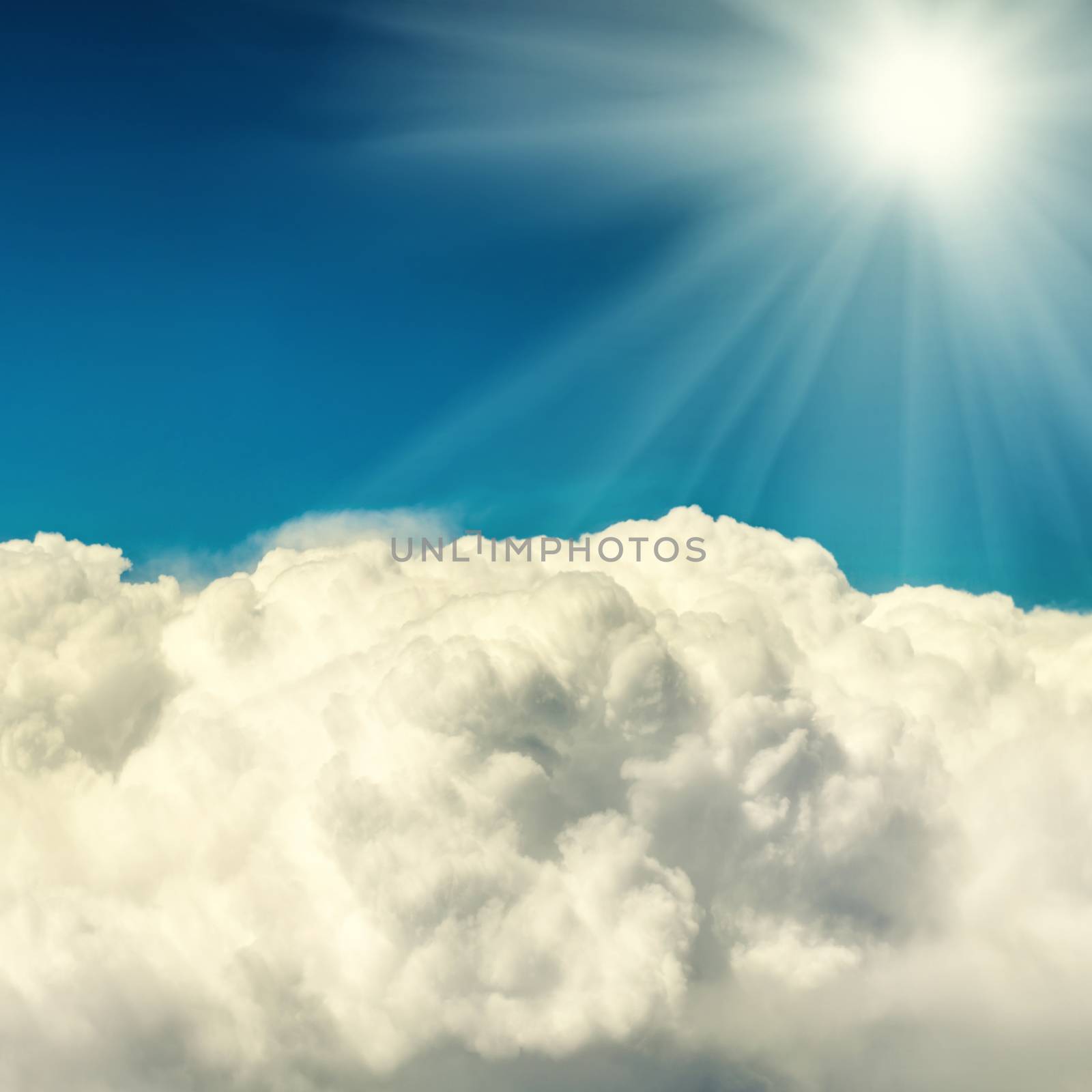 Clouds and blue sky. Natural background with shining sun