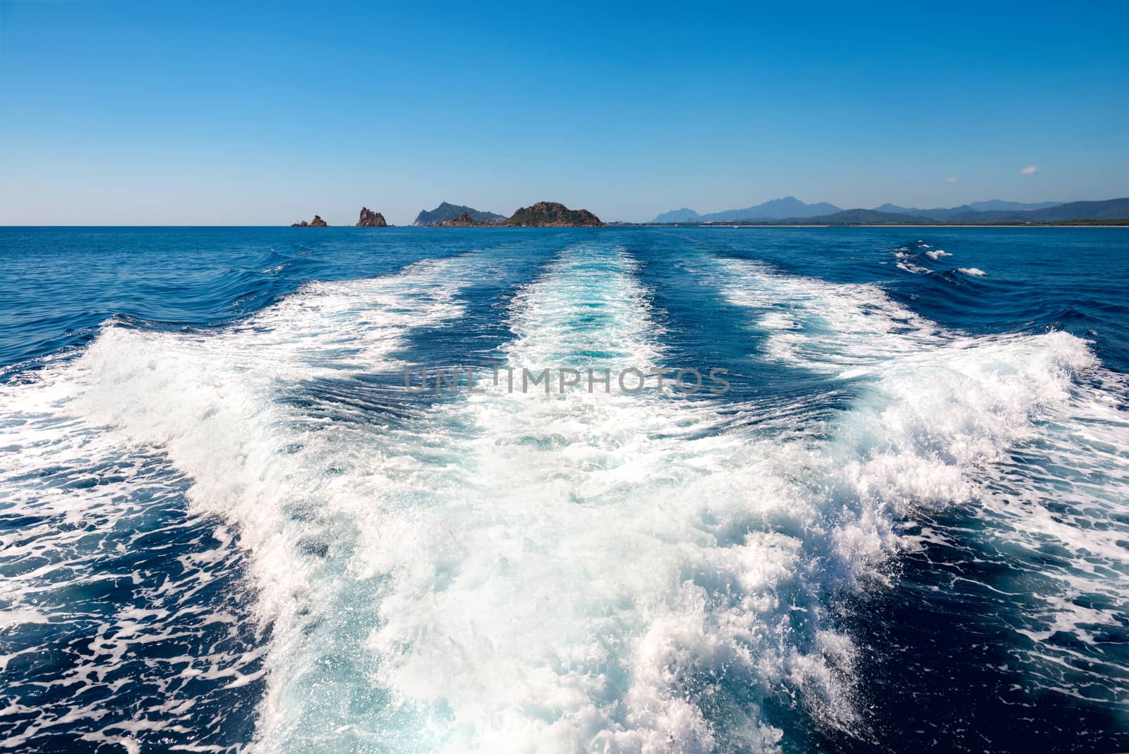 Waves on blue sea behind the speed boat water in sunny day