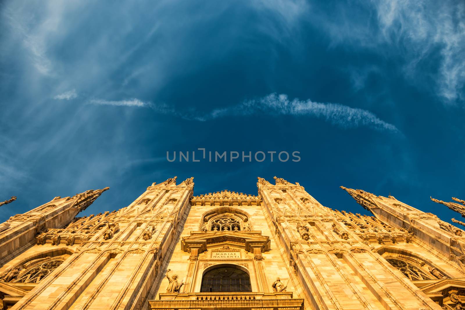 Night view of famous Milan Cathedral (Duomo di Milano) on piazza in Milan, Italy