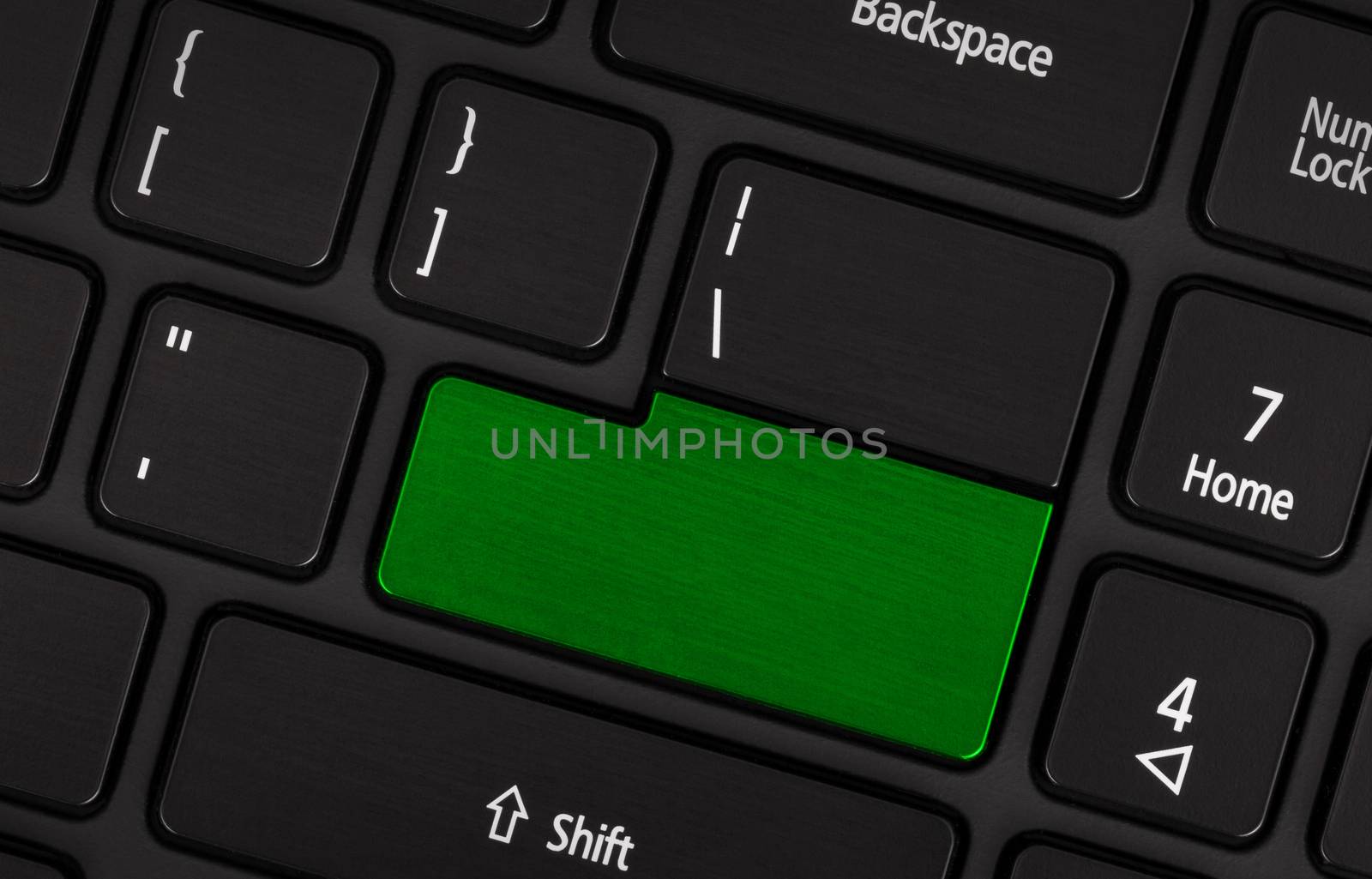 Laptop computer keyboard with blank green button by michaklootwijk