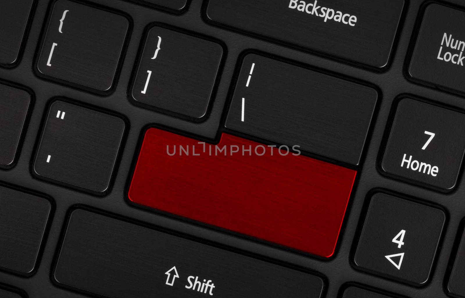 Laptop computer keyboard with blank red button for text