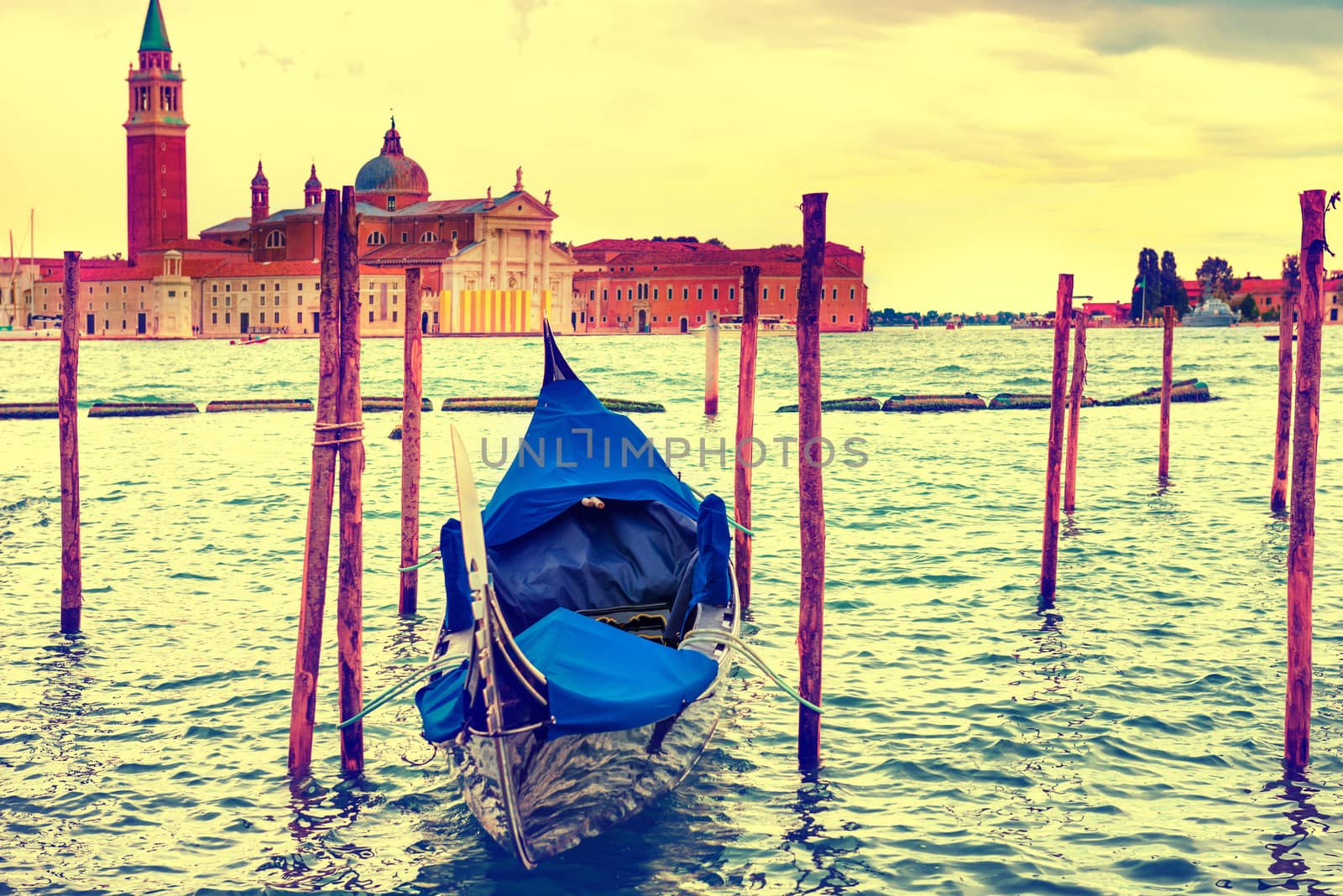 Gondola at sunset near the Piazza San Marco, Venice, Italy. Colorized like instagram filter