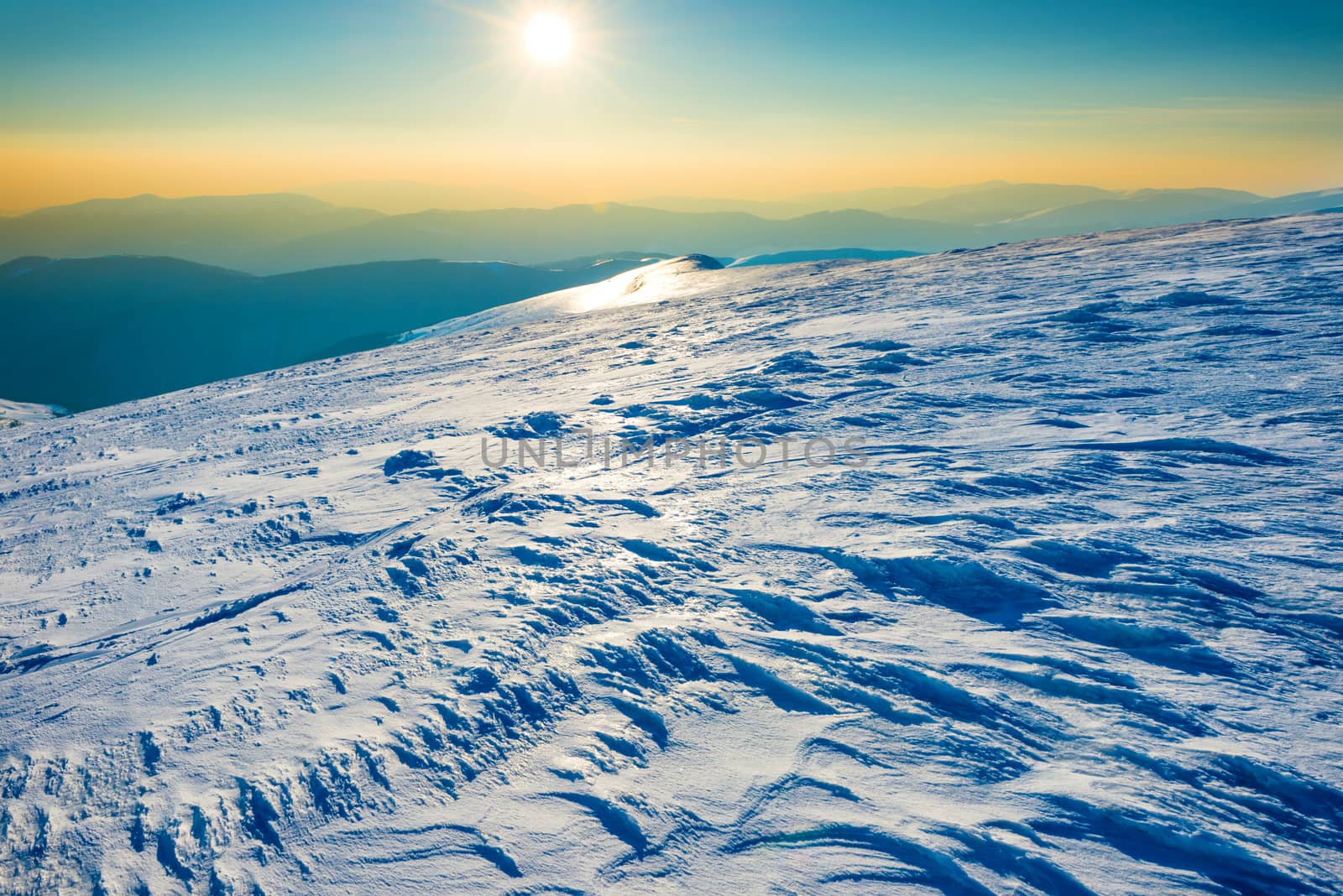 Bright sun in winter mountains by vapi