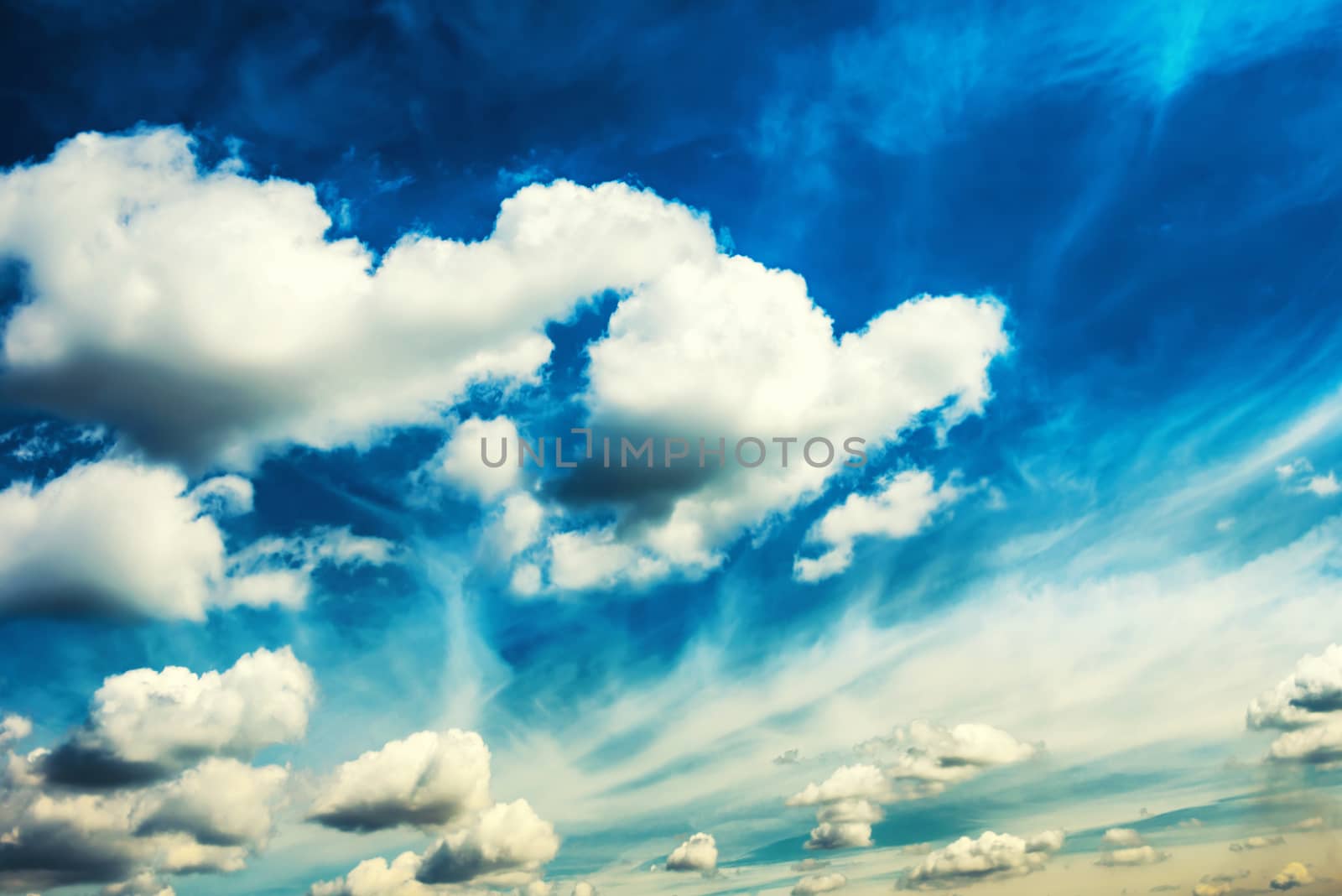 White fluffy clouds on the blue sky by vapi
