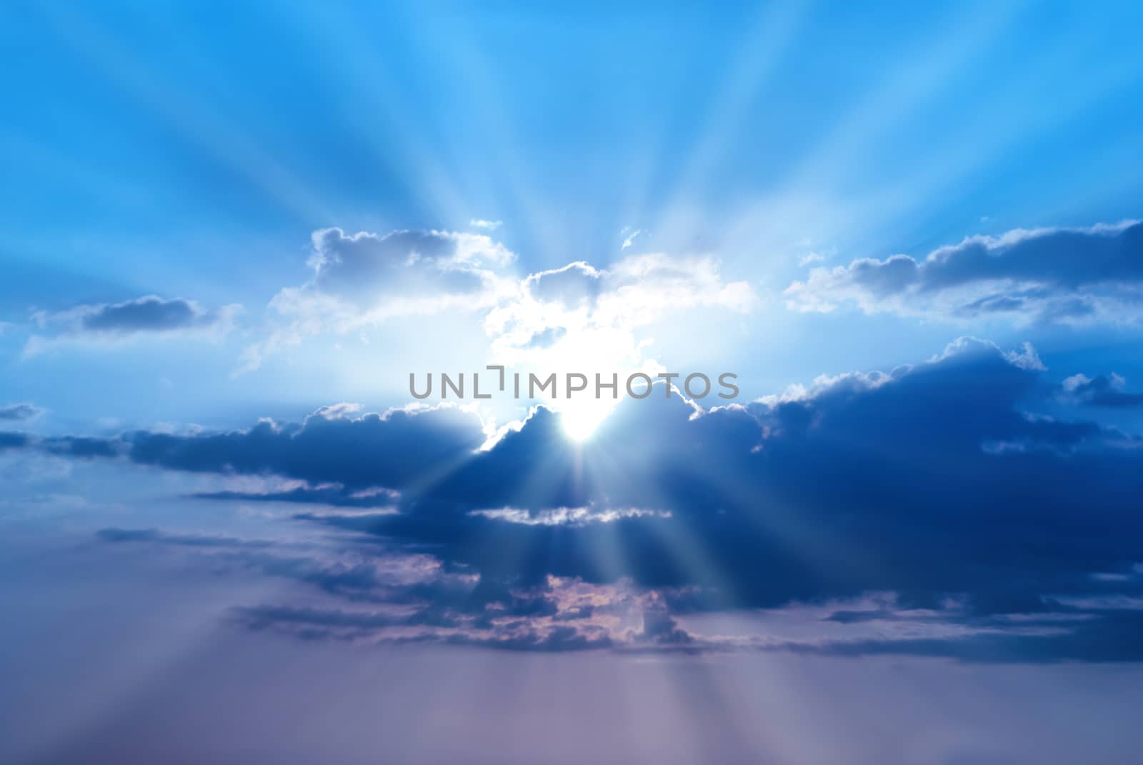 Sunset is beautiful blue sky with sunbeams and clouds