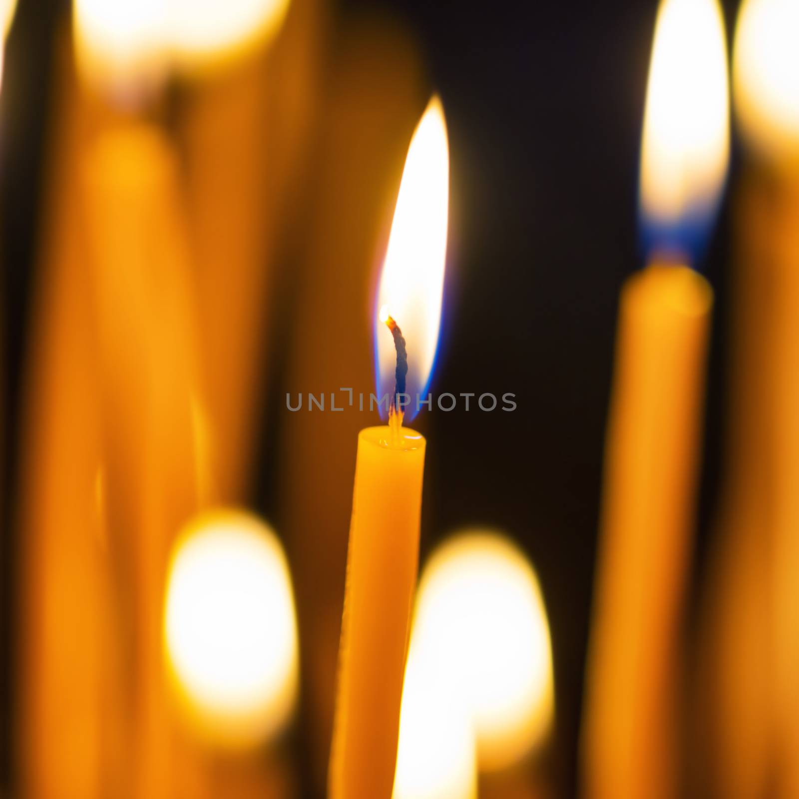 Light of candles in the church by vapi