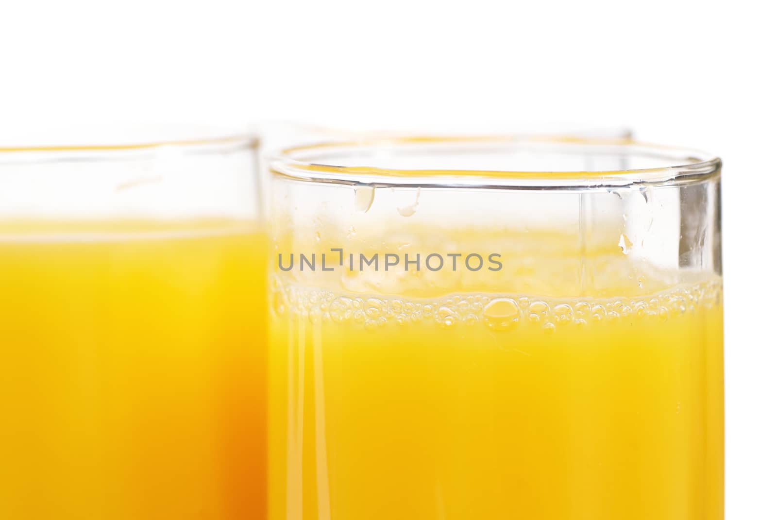 Glasses full of fresh orange juice isolated on white
