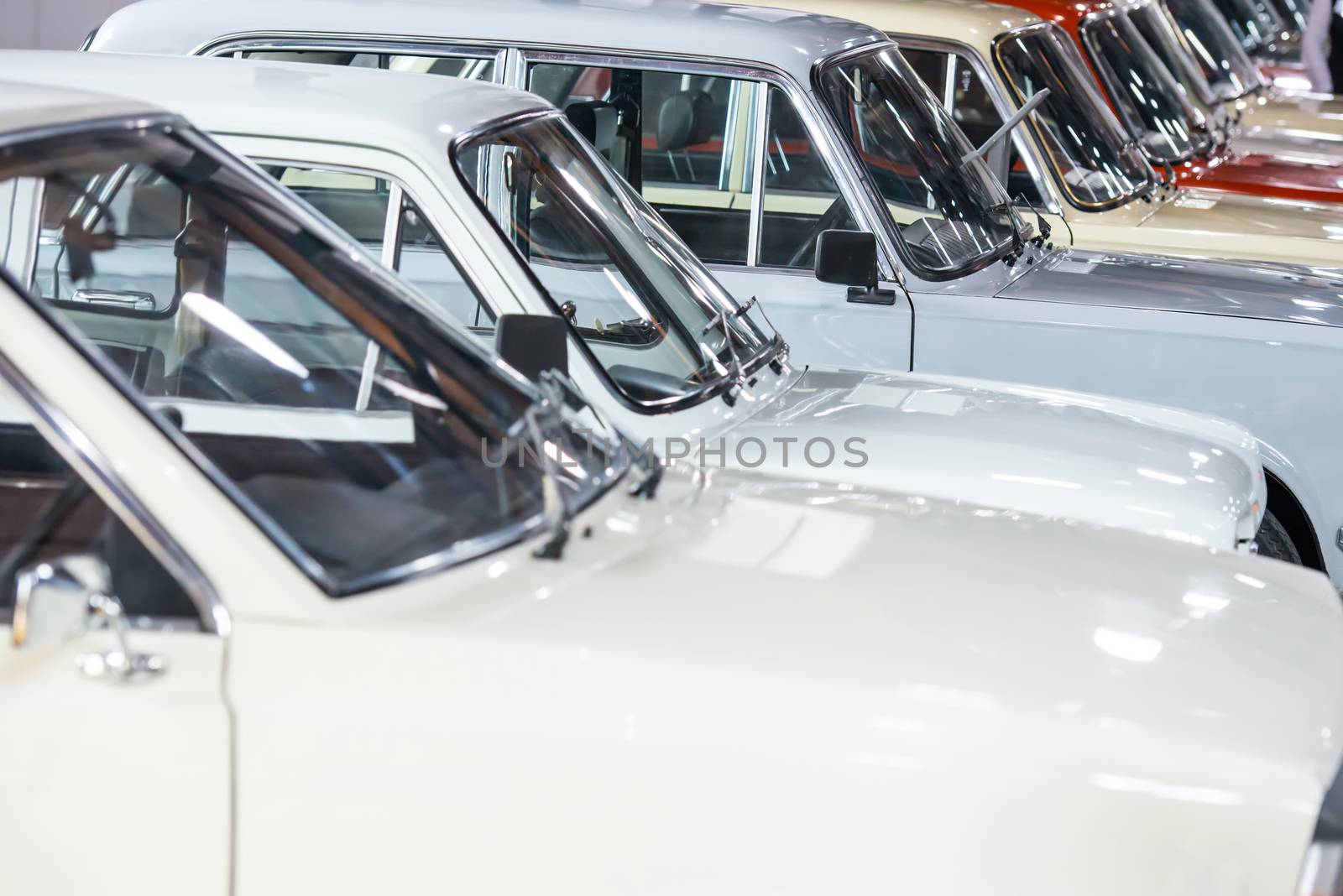 White cars in a row on parking lot