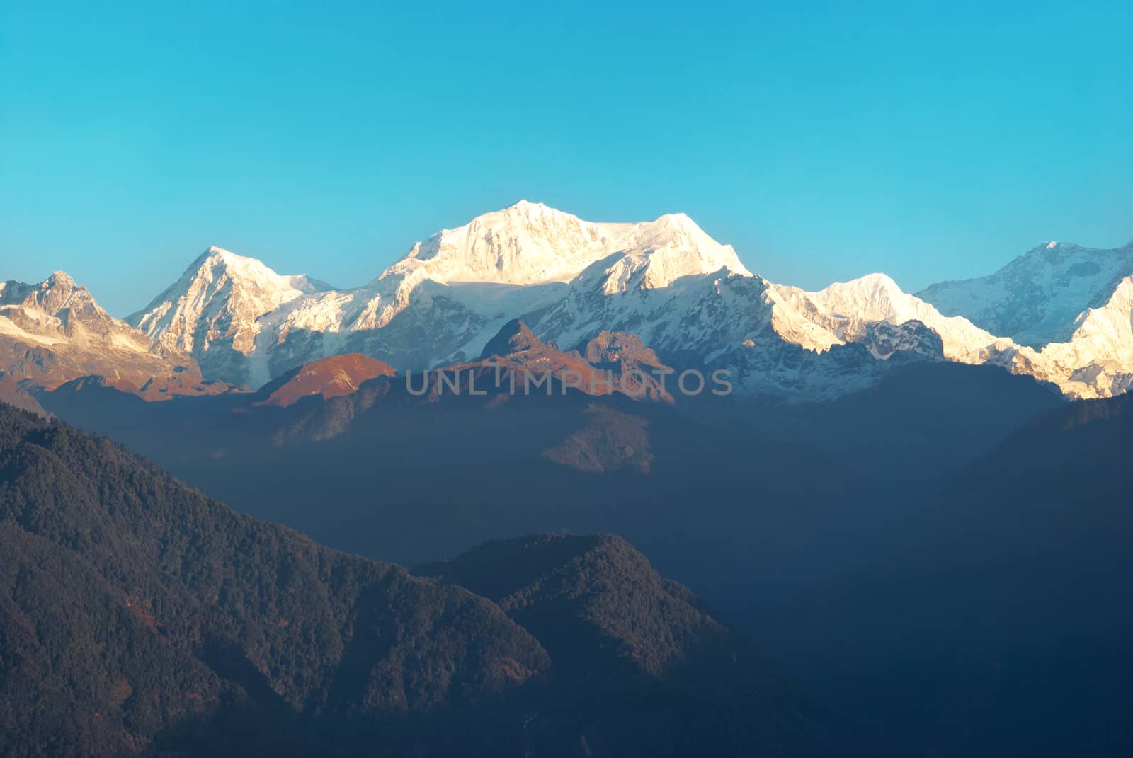 Beautiful sunrise above high mountain Kangchenjunga, India