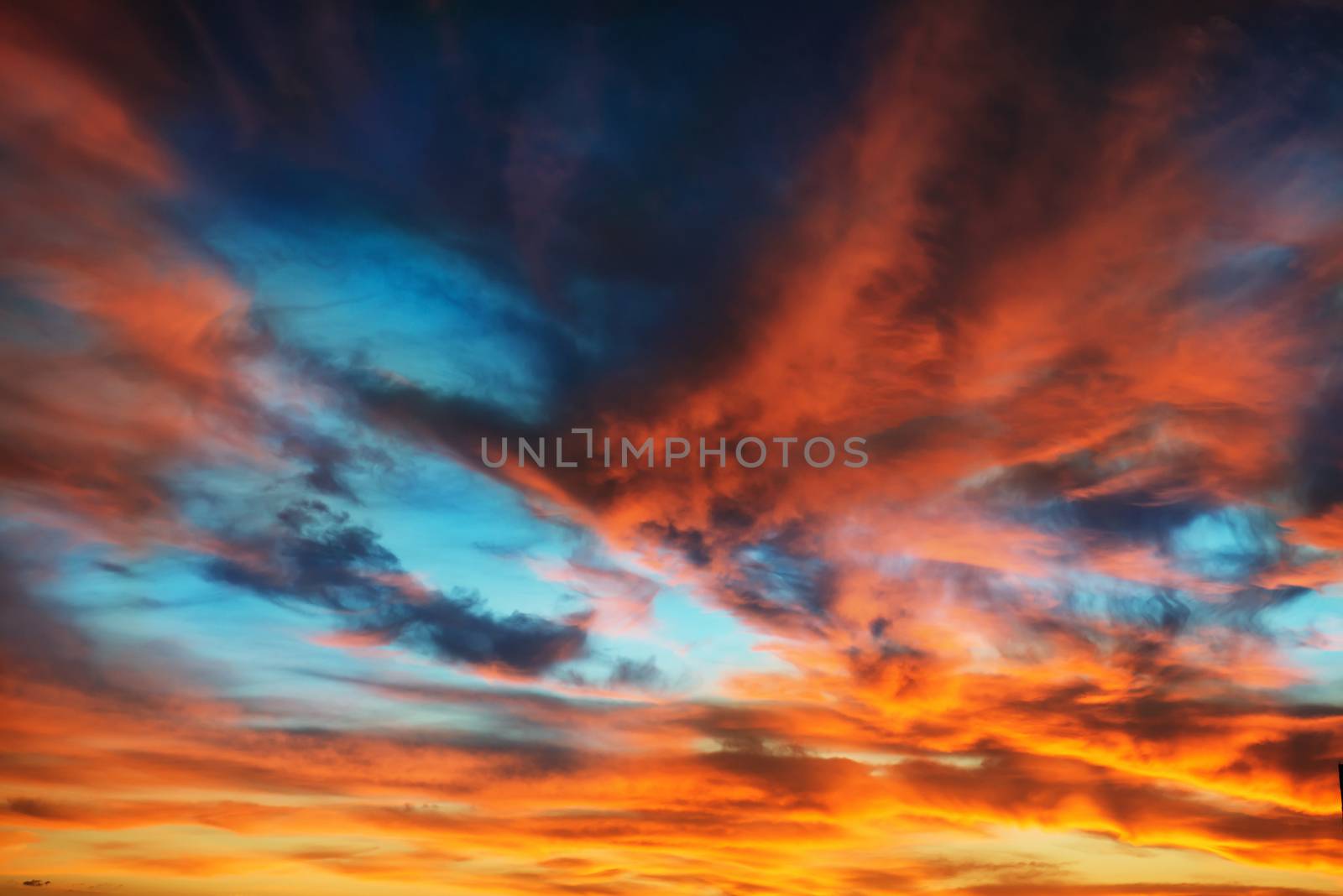 Colorful orange and blue dramatic sky by vapi