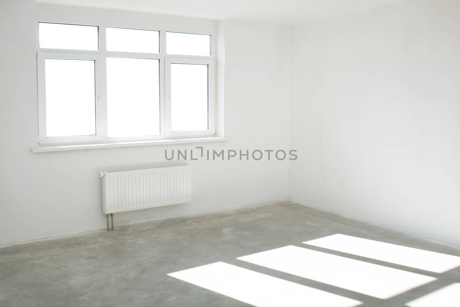 White room with window full of light