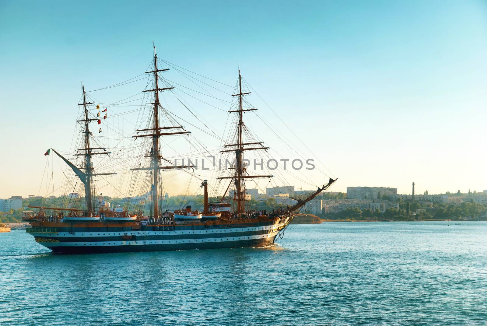 Beautiful ship sailboat in the blue sea comes into bay