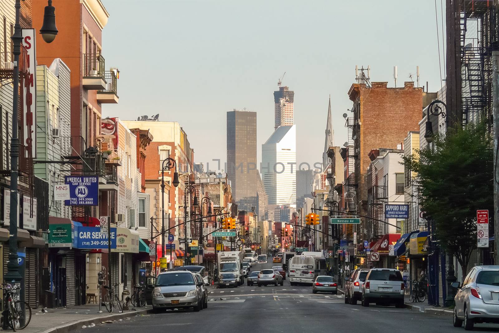 Brooklyn, New York - August 16, 2014: Greenpoint's Manhattan Ave with Manhattan skyscrapers.