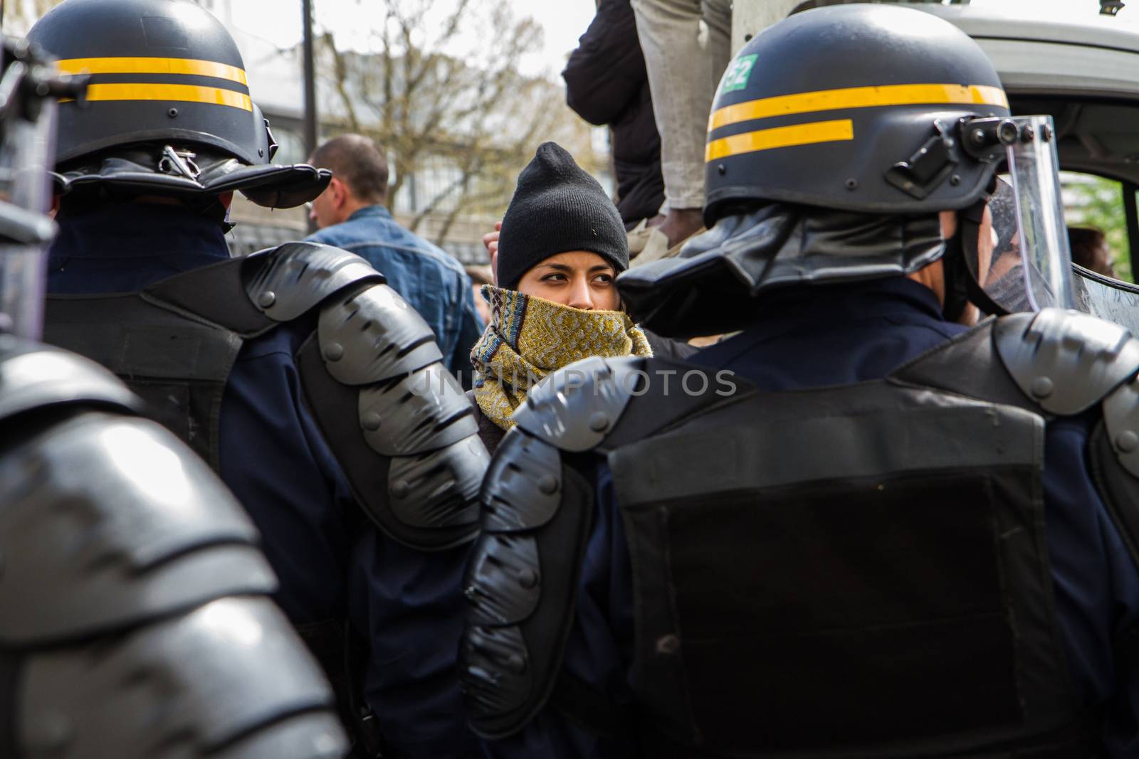 FRANCE, Paris: A woman faces riot policemen as hundreds demonstrate against the French government's proposed labour law reforms on April 14, 2016 in Paris. Fresh strikes by unions and students are being held across France against proposed reforms to France's labour laws, heaping pressure on President Francois Hollande who suffered a major defeat over constitutional reforms on March 30.