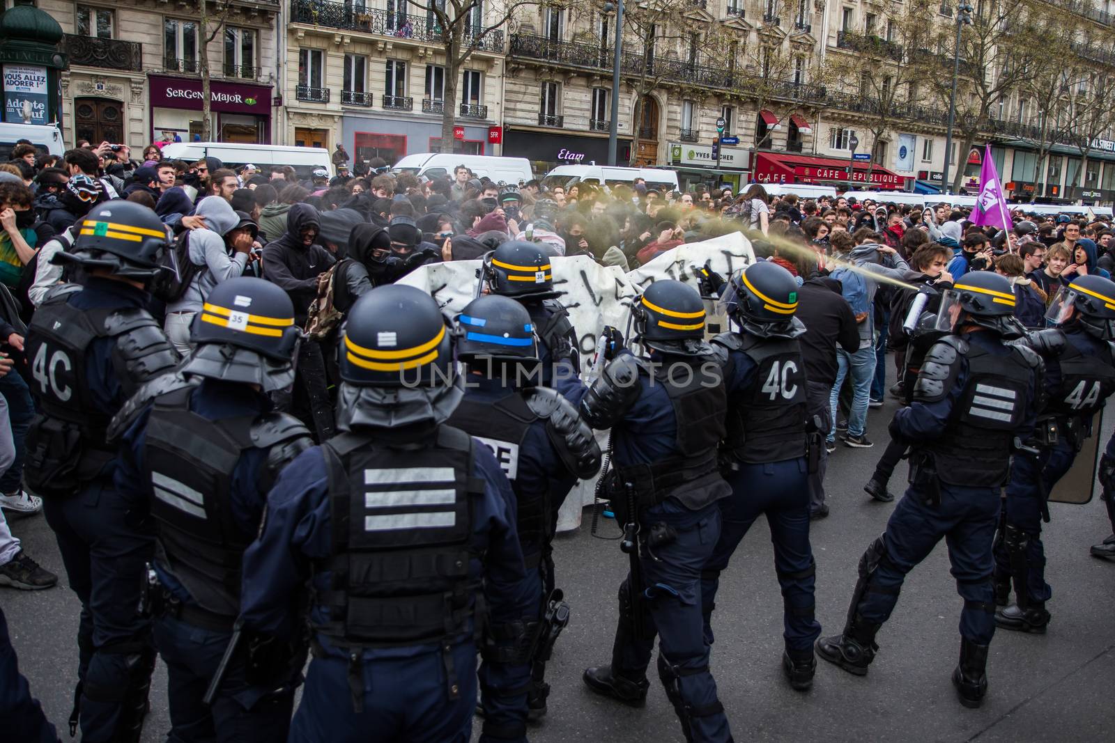 FRANCE, Paris: Riot policemen throw tear gas at a crowd of protesters as hundreds demonstrate against the French government's proposed labour law reforms on April 14, 2016 in Paris. Fresh strikes by unions and students are being held across France against proposed reforms to France's labour laws, heaping pressure on President Francois Hollande who suffered a major defeat over constitutional reforms on March 30.