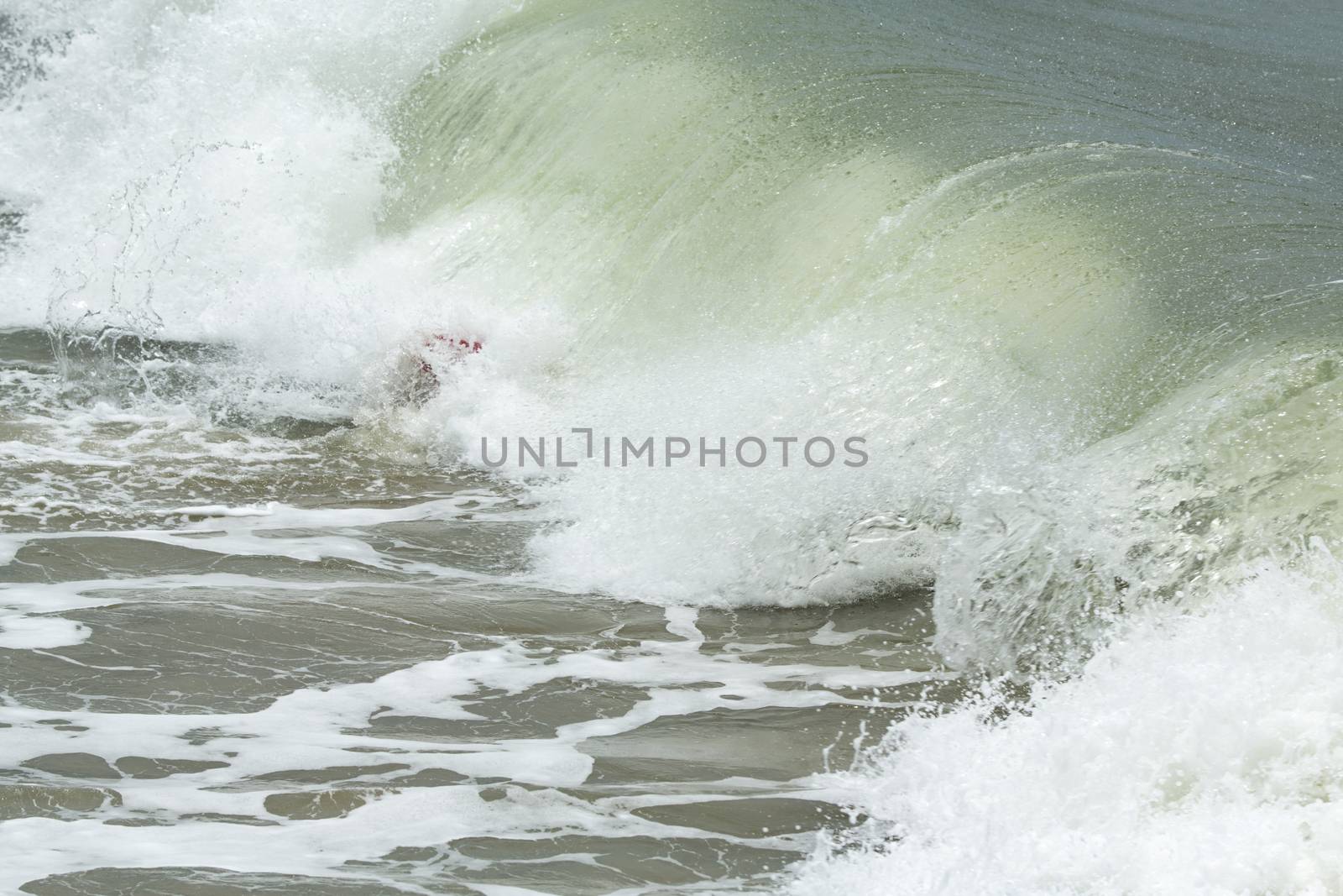Body border under the wave. Surfing training beginning