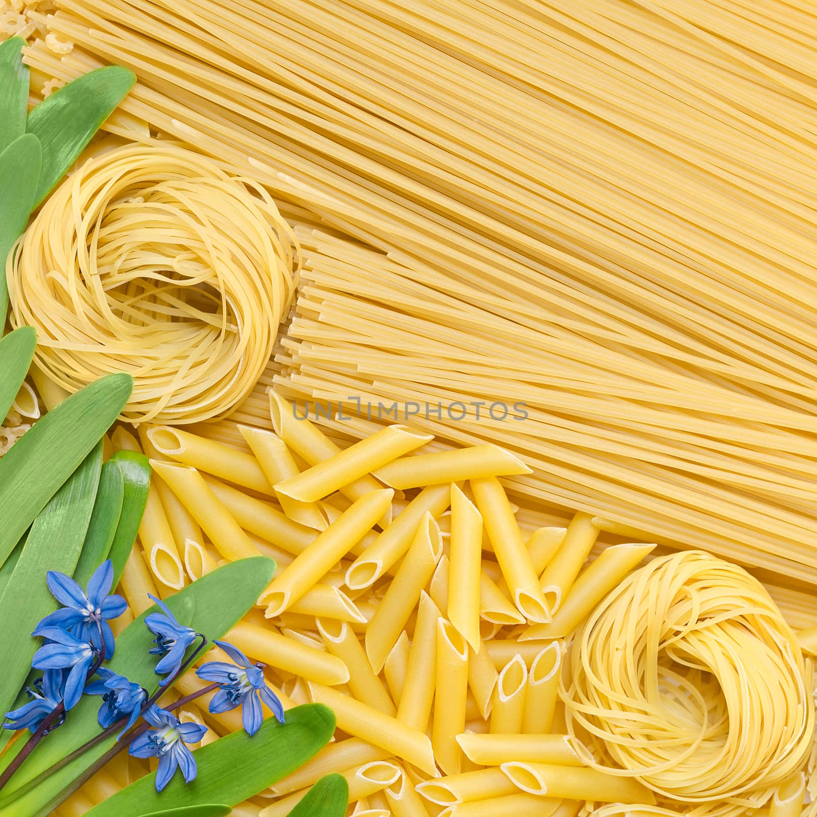 Different pasta lie on the surface. by Gaina