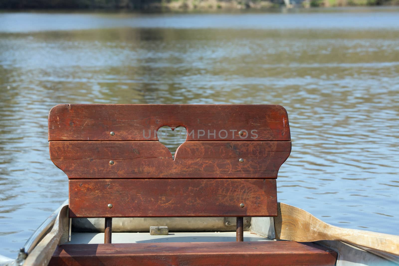 Row boat with heart on a lake