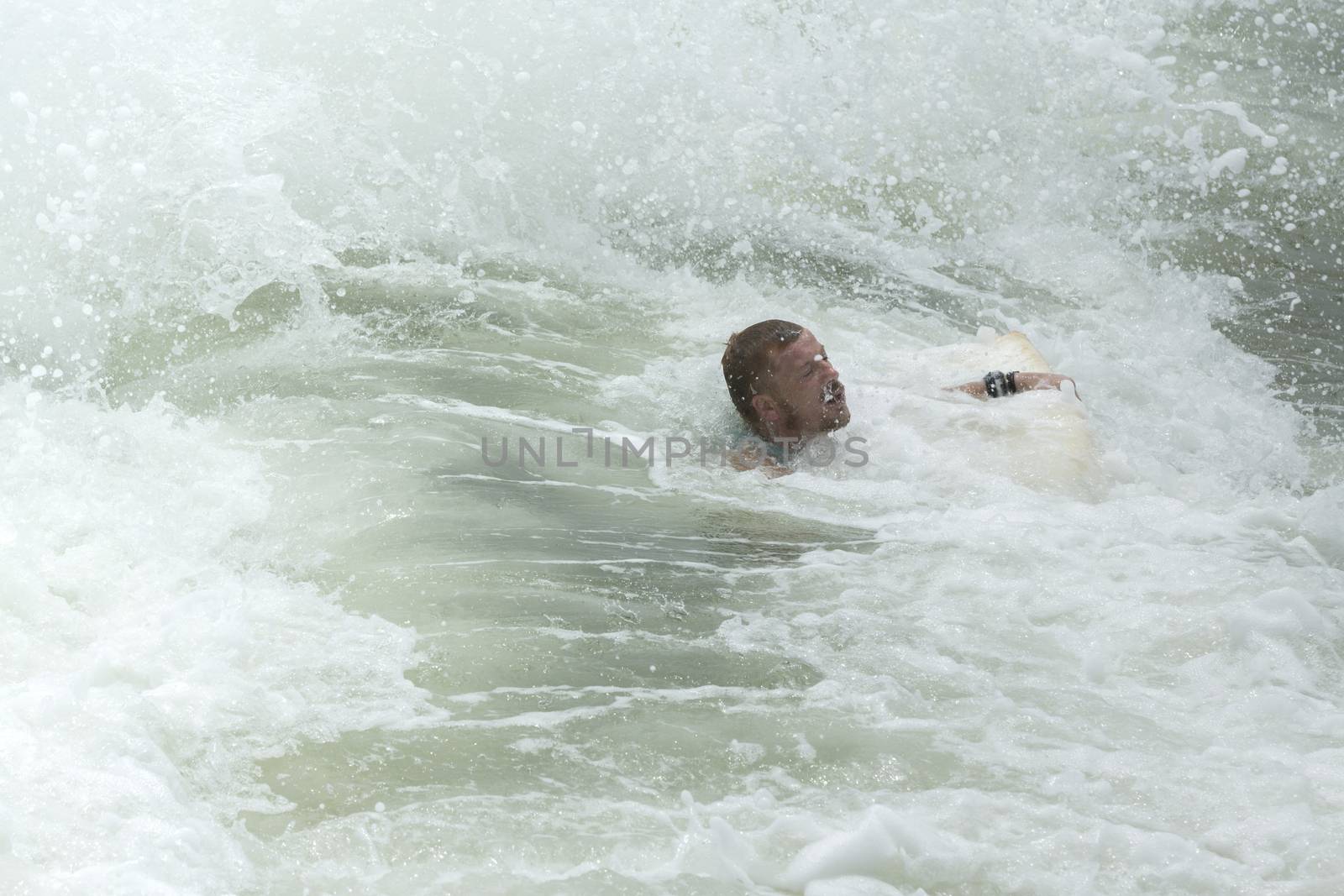 Man Body Boarder surfing on the waves Sea beach