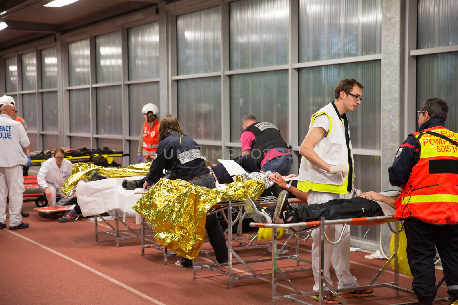 FRANCE, Toulouse: Civilians, medical staff, firemen and rescuers take part in a simulation exercice of terrorist attack at the Toulouse stadium on April 14, 2016 as part of the Euro 2016. 